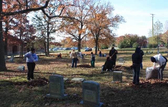 Volunteers spruce up Woodlawn Cemetery for Veterans Day