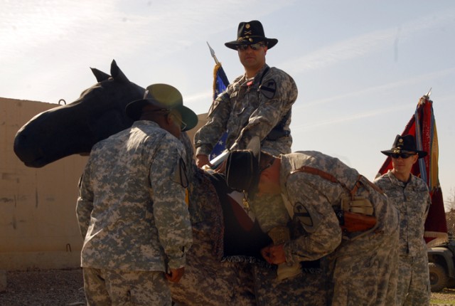 Major Jose Martinez, the operations officer for 15th Brigade Support Battalion, 2nd Brigade Combat Team, 1st Cavalry Division, receives his gold spurs from Lt. Col. Chris Whittaker, the commander of 15th BSB, during an award ceremony at Forward...
