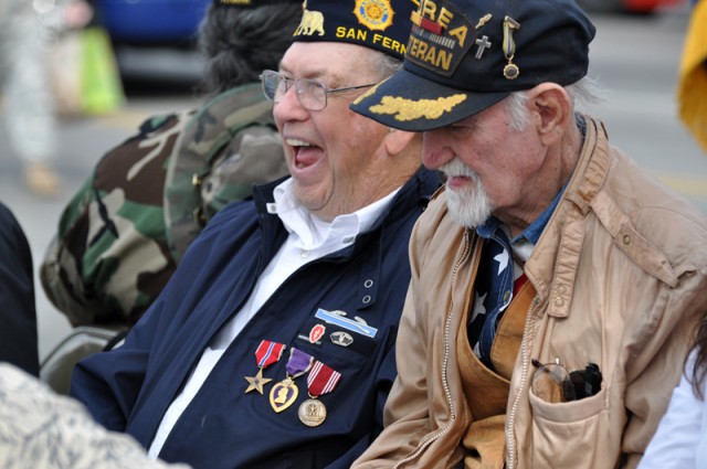 Vets share a laugh before parade