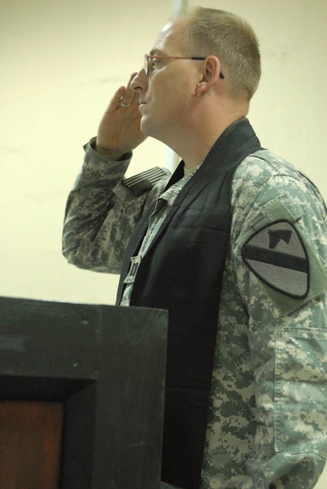 CAMP TAJI, Iraq - Olivebridge, N.Y. native, Chap. (Capt.) Fredrick Johnsen, the chaplain for 115th Brigade Support Battalion, 1st Brigade Combat Team, 1st Cavalry Division, salutes during the playing of the National Anthem at the Veteran's Memorial D...