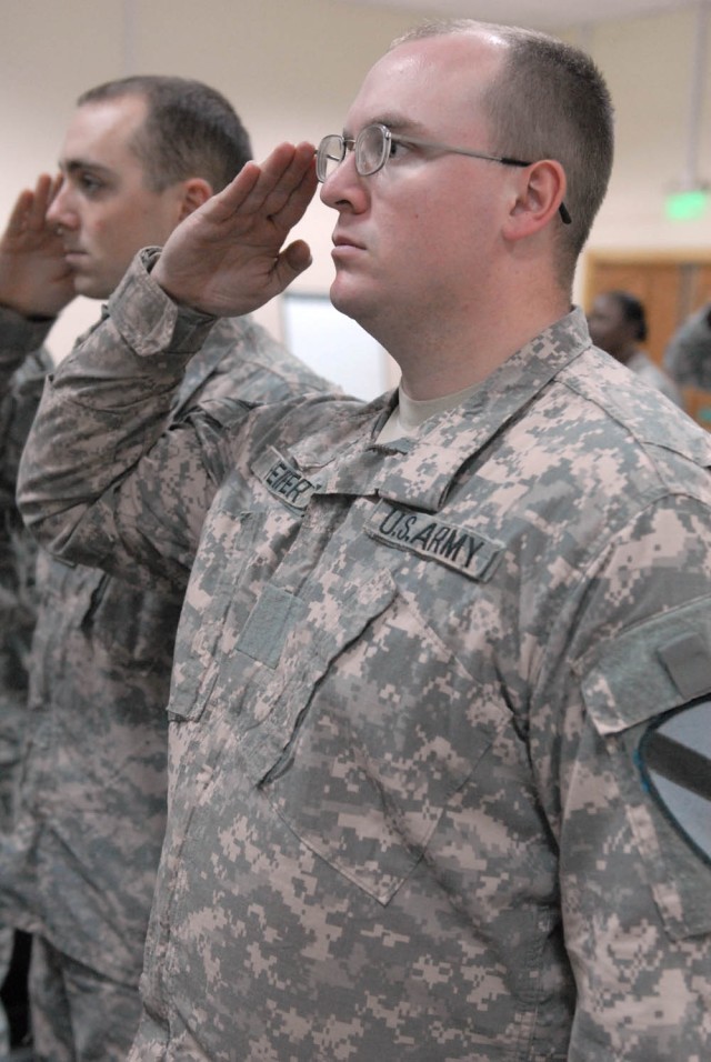 CAMP TAJI, Iraq - Hopewell, Va. native, Pvt. Michael Peifer, assigned to 115th Brigade Support Battalion, 1st Brigade Combat Team, 1st Cavalry Division, salutes all service members during the Veteran's Memorial Day service at Camp Taji, Nov. 12. On N...