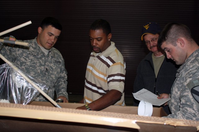 From left to right: Staff Sgt. Jonathan Agrait, assigned to the 4th Brigade Combat Team, 1st Cavalry Division "Long Knives" from Houston, Texas; Rufus Pruitt, a Regional Manager of the United State Army Material Agency (USAMA); Joe Miller, USAMA Eagl...