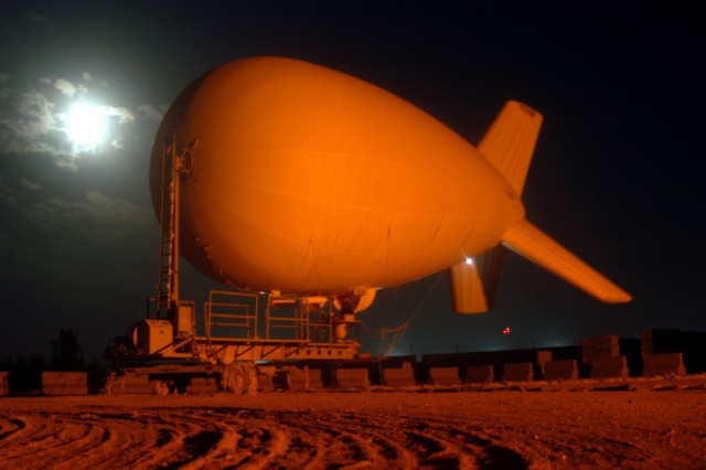 CONTINGENCY OPERATING LOCATION Q-WEST, Iraq - The 17-meter Aerostat of Contingency Operating Location Q-West secured to its mobile mooring station during a windy night Nov. 2. The aerostat - maintained and operated by crewmembers from A Company,...