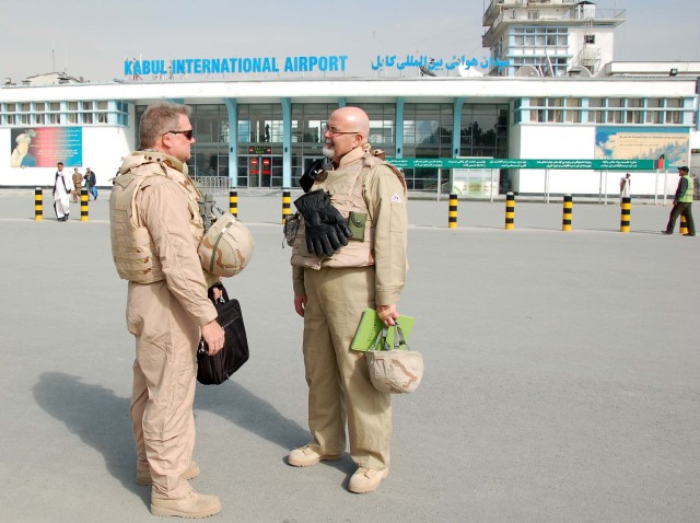 Project managers in front of Kabul International Airport terminal