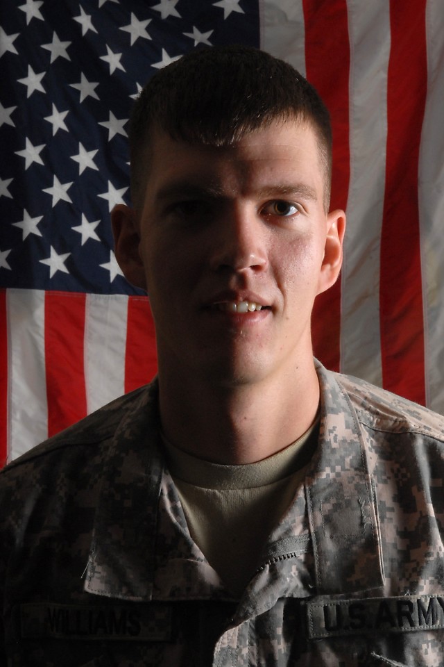 CAMP TAJI, Iraq-Light emphasizes the left side of Sgt. 1st Class Pierce Williams' face where, along with his upper torso, he took the brunt of an improvised explosive device, Dec. 10, 2006. Williams, of Sturgis, S.D., an intelligence sergeant of...