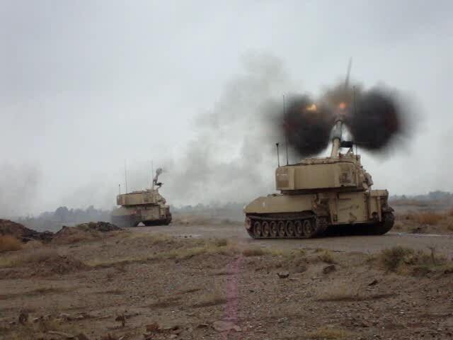 CAMP TAJI, Iraq - Smoke flashes from the tube as an M109A6 "Paladin" howitzer assigned to Battery B, 1st Battalion, 82nd Field Artillery Regiment, 1st Brigade Combat Team, 1st Cavalry Division, fires a high-explosive projectile during an emergency...
