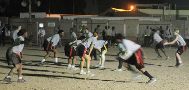 Powder Puff football teams play under Friday night lights