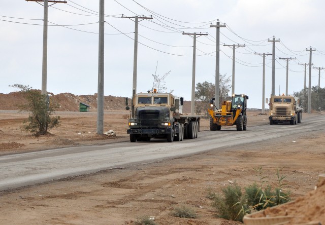 A small of 1174th Transportation Company, 395th Combat Sustainment Support Battalion, 15th Sustainment Brigade, trucks and a civilian contractor forklift convoy delivers upwards of 30,000 bottles of waters to troops and civilians around base here, No...