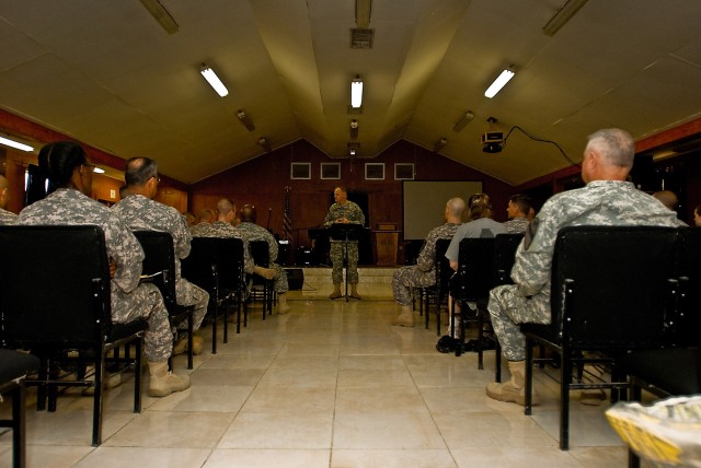 BAGHDAD -Soldiers from the Multi National Division - Baghdad listen to a spiritual message given by the Army's highest ranking chaplain, Major Gen. Douglas Carver, Nov.r 22. The Army's chief chaplain made his Thanksgiving trip to Baghdad for the...