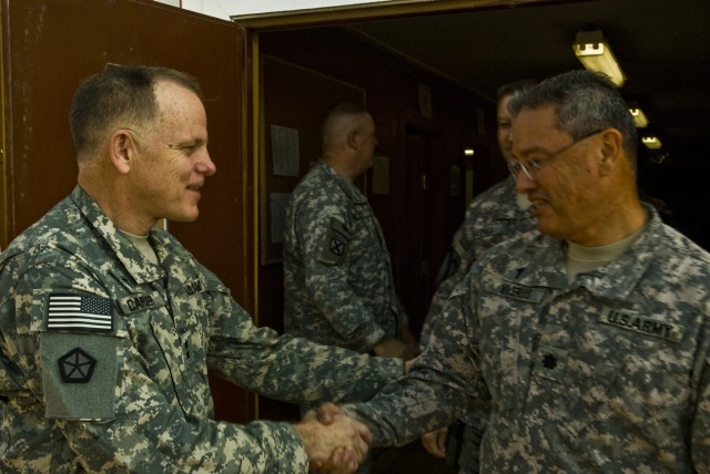 BAGHDAD - Chief Chaplain of the Army, Major Gen. Douglas Carver, individually thanks each Soldier in attendance following a worship service at Camp Liberty's Division Chapel, Nov. 22. Douglas said it was his personal mission to come and thank...