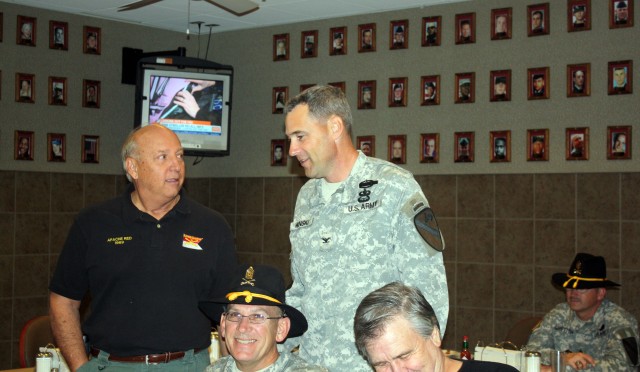 Col. Brian Winski, commander of 4th Brigade Combat Team, 1st Cavalry Division "Long Knives," speaks to retired Col. Joe Bowen during breakfast at Fort Hood's Operation Iraqi Freedom dining facility Nov. 10.  The breakfast was part of a Veteran's...