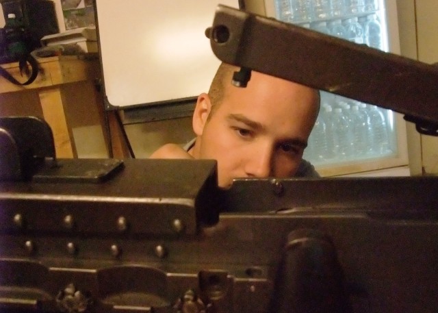 CONTINGENCY OPERATING LOCATION Q-WEST, Iraq - Spc. Chance W. Jefferss, II, a native of Southaven, Miss., and vehicle gunner with A Company, 2nd Battalion, 198th Combined Arms out of Hernando, Miss., cleans an M2 .50 caliber machine gun in the...