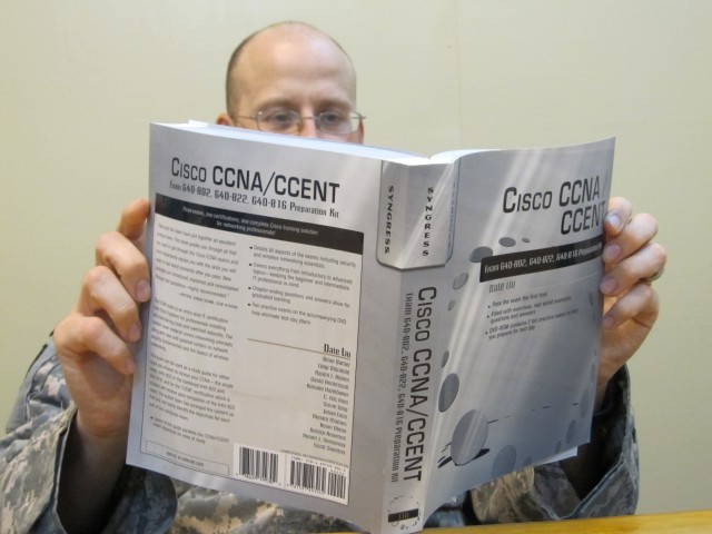 A Soldier with the 15th Special Troops Battalion, 15th Sustainment Brigade, studies for the Cisco Certified Network Associate exam. The STB's Company A plans to open a information technology testing center at Contingency Operating Location Q-West...