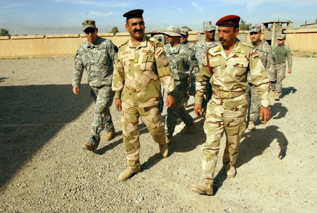 Command Sergeants Major Jeffery Hof (left), Nasser Abed Al Hassen (middle), and Waleed Ibrahim Ismael (right), the 2nd Brigade Combat Team, 1st Cavalry Division, 12th Iraqi Army Division, and the 15th Iraqi Army Brigade top enlisted Soldiers, conduct...