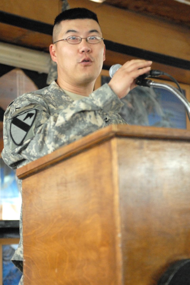 CAMP TAJI, Iraq - Grand Rapids, Mich. native, Capt. Jeff Pyun, chaplain with the 1st Battalion, 82nd Field Artillery Regiment, 1st Brigade Combat Team, 1st Cavalry Division, prayed for the nation at the Command Sgt. Maj. Cooke Dining Facility for the...