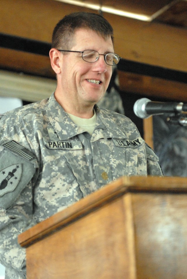 CAMP TAJI, Iraq - Richton, Miss. native, Maj. Terry Partin, chaplain withthe 155th Heavy Brigade Combat Team, prayed for the families of the Soldiers serving in Iraq and the families all around the world at the Command Sgt. Maj. Cooke Dining Facility...