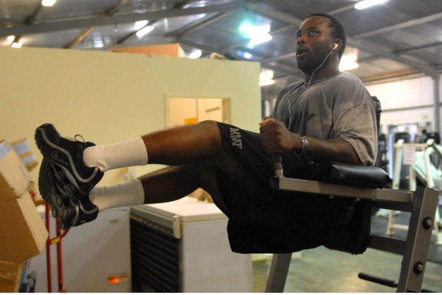 CAMP TAJI, Iraq - Miami native, Sgt. Herman Johnson, a tanker assigned to Company D, 2nd Battalion, 8th Cavalry Regiment, 1st Brigade Combat Team, 1st Cavalry Division, performs the leg lifts designed to strengthen the abdominal area, during a...