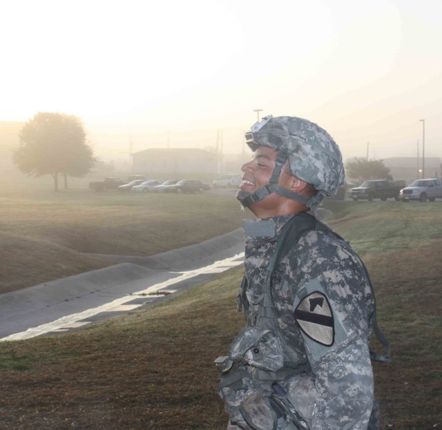 Pvt. Jarrick Rehn, Company A, 2nd Battalion, 7th Cavalry Regiment, 4th Brigade Combat Team, 1st Cavalry Division, breathes a sigh of relief after completing a 12-mile road march Nov 23. Rehn was one of 14 Soldiers who earned their Expert Infantry...