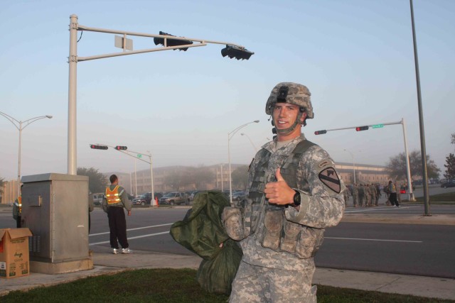 2nd Lt. Daniel Fritz, assigned to the 2nd Battalion, 12th Cavalry Regiment, 4th Brigade Combat Team, 1st Cavalry Division, gives a thumbs up during EIB testing. He was one of 14 Soldiers who earned their Expert Infantry Badge, and received special...