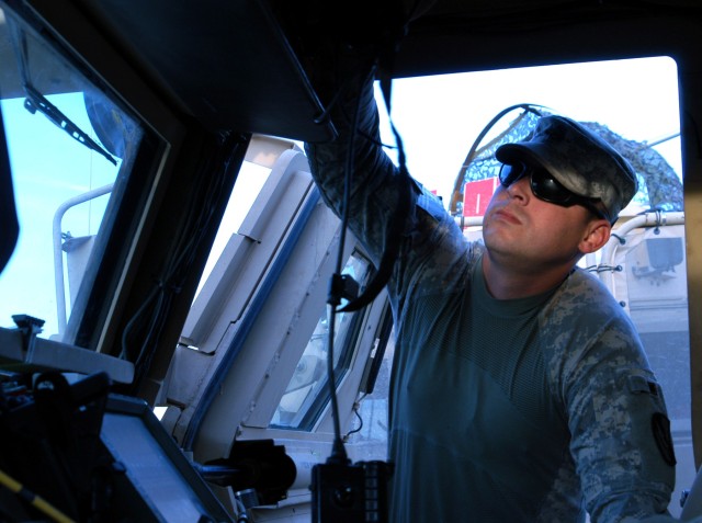 CONTINGENCY OPERATING LOCATION Q-WEST, Iraq - Staff Sgt. Jonathan A. Parks, a native of Grenada, Miss., and scout truck commander with 1st Platoon, B Company, 2nd Battalion, 198th Combined Arms out of Greenwood, Miss., performs a pre-combat check...