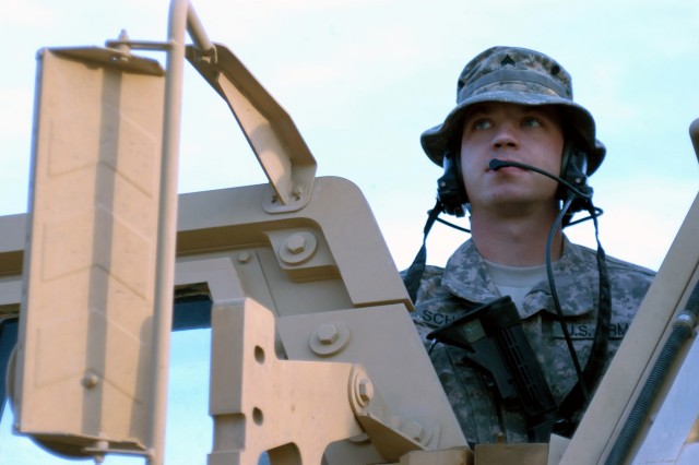 CONTINGENCY OPERATING LOCATION Q-WEST, Iraq - Sgt. Joseph R. Schultz, a Minneapolis, Minn., native and assistant convoy commander with 1st Platoon, B Company, 2nd Battalion, 198th Combined Arms out of Greenwood, Miss., stands in the door of his...
