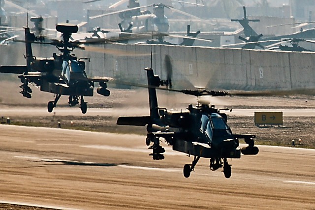 CAMP TAJI, Iraq-AH-64D Apache attack helicopters from Company C, 4th Battalion, 227th Aviation Regiment, 1st Air Cavalry Brigade, 1st Cavalry Division, depart from the flightline, here, Dec. 3, on their way to al-Asad, where Co. C will  become a...