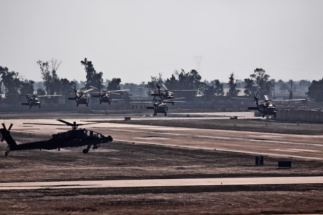 CAMP TAJI, Iraq-Six UH-60 Black Hawk helicopters from 3rd Battalion, 227th Aviation Regiment, 1st Air Cavalry Brigade, 1st Cavalry Division, depart the flightline, here, Dec. 3, on their way to al-Asad, where 3-227th will  become a detachment...