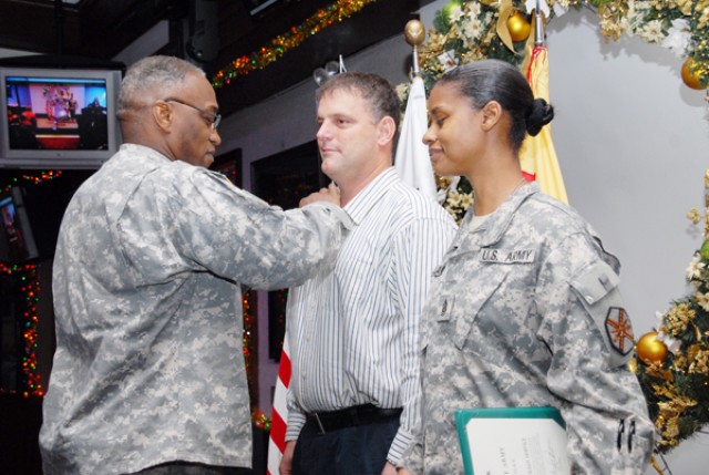 Commander awards medal during ceremony
