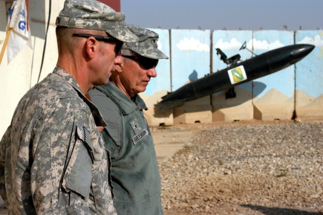 CONTINGENCY OPERATING LOCATION Q-WEST, Iraq - Lt. Col. James L. Sisson (foreground), commander of 2nd Battalion, 114th Field Artillery, out of Starkville, Miss., speaks with Brig. Gen. William L. Freeman, Jr., the adjutant general of the Mississippi ...