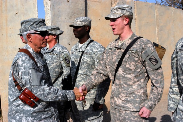 CONTINGENCY OPERATING LOCATION Q-WEST, Iraq - Brig. Gen. William L. Freeman, Jr. (left), the adjutant general of the Mississippi National Guard, speaks with Soldiers of B Company, 2nd Battalion, 198th Combined Arms, out of Greenwood, Miss., during a ...