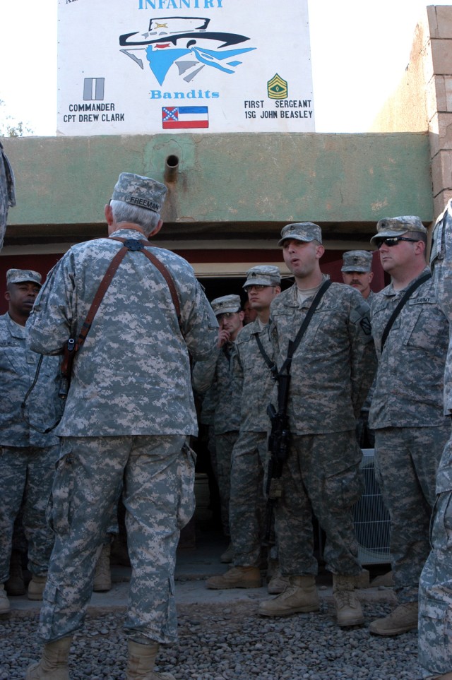 CONTINGENCY OPERATING LOCATION Q-WEST, Iraq - Brig. Gen. William L. Freeman, Jr. (left, back turned), the adjutant general of the Mississippi National Guard, speaks with Soldiers of A Company, 2nd Battalion, 198th Combined Arms, out of Hernando, Miss...