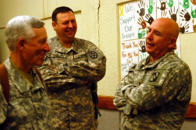 CONTINGENCY OPERATING LOCATION Q-WEST, Iraq - Brig. Gen. William L. Freeman, Jr. (left), the adjutant general of the Mississippi National Guard, chats with Col. Larry Phelps, commander of the 15th Sustainment Brigade, out of Fort Hood, Texas, which o...