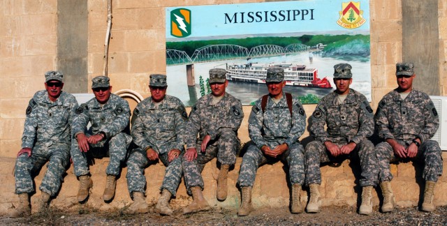 CONTINGENCY OPERATING LOCATION Q-WEST, Iraq - The adjutant general and the command sergeant major of the Mississippi National Guard sit with senior leaders in front of the base defense operations center and mayor cell of Contingency Operating Locatio...