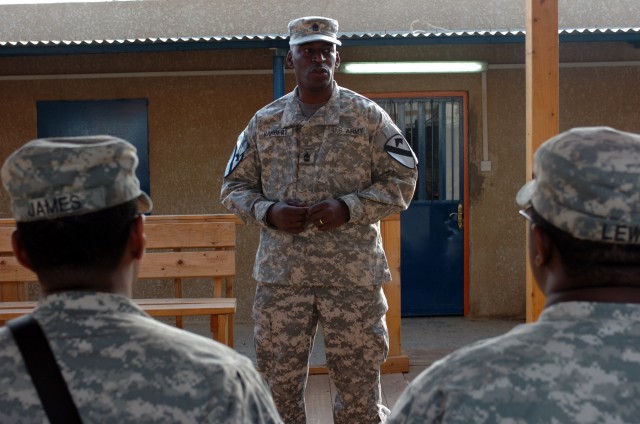 CAMP TAJI, Iraq- Sgt. Maj. Maurice Rambert, from Charleston, S.C., the G-6 sergeant major for the 1st Cavalry Division, speaks to brigade commo Soldiers from 2nd Battalion, 227th Aviation Regiment, 1st Air Cavalry Brigade, as part of "Signal Day," he...
