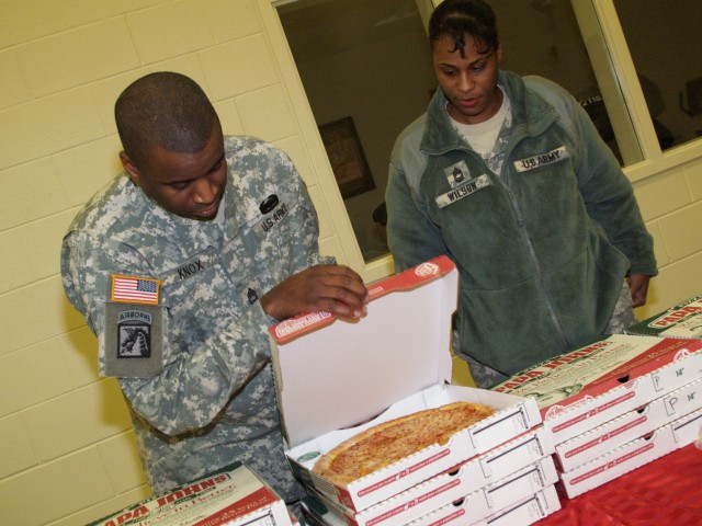 Soldiers bring camouflage Christmas to Sunrise Children&#039;s Home
