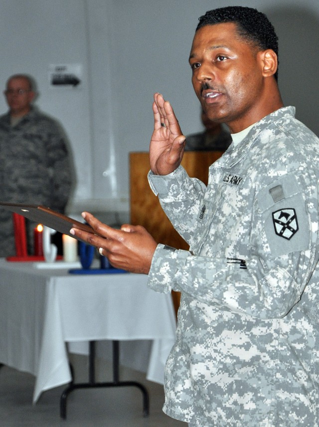 1st Sgt. Willie Johnson [background], A Company, 15th Special Troops Battalion, first sergeant, administers the Oath of the Noncommissioned Officer at an NCO induction ceremony in the Morale Welfare and Recreation tent here Dec. 12. (U.S. Army...