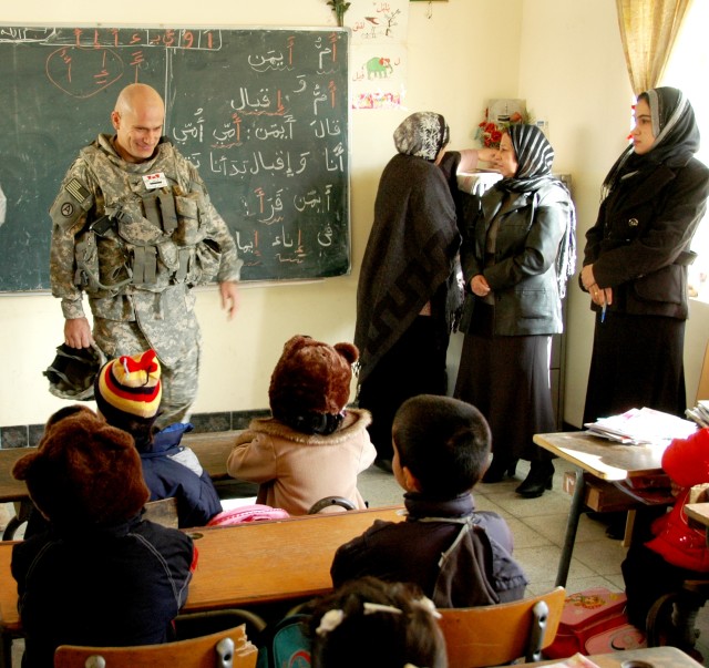 Anninos and students at Al-Zuhoor School