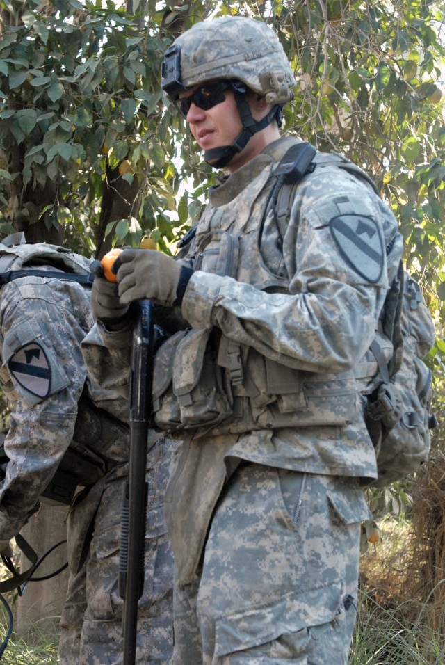 BAGHDAD - St. Mary's County, Md. native, Cpl. Timothy Bennett, a team leader assigned to the 1st Squadron, 7th Cavalry Regiment, 1st Brigade Combat Team, 1st Cavalry Division, enjoys an orange while on patrol outside Joint Security Station Istiqlal, ...