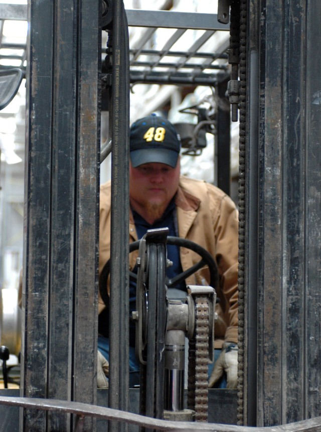 Derek Shirley, delivery manager for Lowe's operates a forklift loaded with materials by the Soldiers of the 15th SB that was delivered to the home of Sgt. Kimberly Munley, the civilian officer who was injured during the Nov. 5 shootings. (U.S....