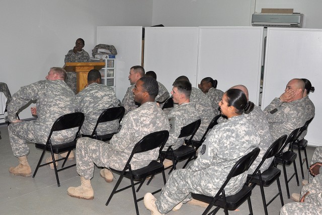Sgt. 1st Class Johnnie Mitchell, the equal opportunity advisor for the 13th Sustainment Command (Expeditionary), speaks to students in the first equal opportunity leaders course offered at Contingency Operating Location Q-West Dec. 17. The six-day...