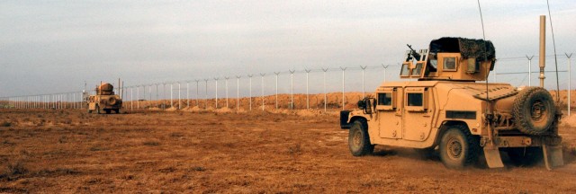 CONTINGENCY OPERATING LOCATION Q-WEST, Iraq - Gun trucks of the force protection company of Contingency Operating Location head back to post after conducting a presence patrol, Dec. 15. The Soldiers serve with the Mississippi Army National Guard's...