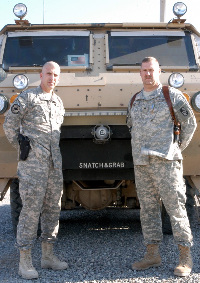 CONTINGENCY OPERATING LOCATION Q-WEST, Iraq - Lt. Col. Kerry Goodman (left), commander of 2nd Battalion, 198th Combined Arms, out of Senatobia, Miss., and a Quitman, Miss., native residing in Meridian, Miss., has just awarded an Army Achievement...