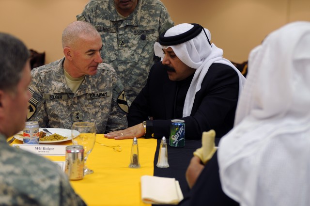 BAGHDAD-Maj. Gen. Daniel Bolger (left), commander of United States Division-Center and the 1st Cavalry Division, speaks with key area sheikhs from around Baghdad, here, Jan. 5.  The recognition luncheon, held at USD-C headquarters on Camp Liberty, se...