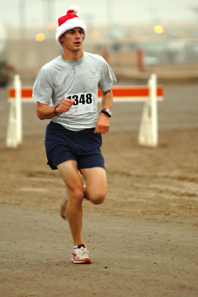 CAMP TAJI, Iraq - He's not Santa Claus, but he may be just as quick. No more than 50 yards away from the finish line and Senior Airman Matthew Klundt with the 732nd Expeditionary Security Forces Squadron, is still running strong. The Fresno,...