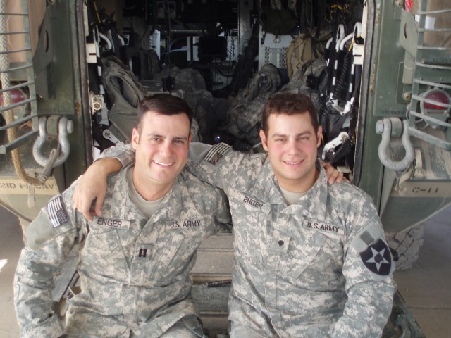 BAQUBAH, Iraq -Capt. Jordan Enger (left), commander of Troop A, 1st Squadron, 7th Cavalry Regiment, 1st Brigade Combat Team, 1st Cavalry Division reunites with his younger brother, Spc. Jared Enger, a cavalry scout in C Troop, 1st Squadron, 14th...