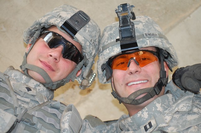 BAQUBAH, Iraq - Spc. Jared Enger (left), a cavalry scout in Troop C, 1st Squadron, 14th Cavalry Regiment, 3rd Stryker Brigade Combat Team, 2nd Infantry Division and his older brother, Capt. Jordan Enger,  commander of Troop A, 1st Squadron, 7th...
