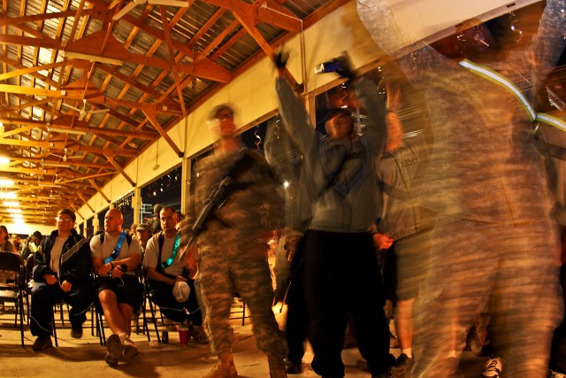 CAMP TAJI, Iraq - Soldiers cheered and shouted to show support for friends on stage during a talent show, here, Dec. 31. The Talent show was part of the entertainment lineup for the New Year's Eve celebration organized by the 115th Brigade Combat...