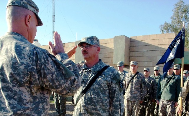 CONTINGENCY OPERATING LOCATION Q-WEST, Iraq - Capt. Drew Clark, a company commander from Madison, Miss., returns the salute of newly promoted Sgt. Russell R. Rippy, assistant sergeant of the guard for the North Entry Control Point, during a...