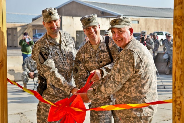 CAMP TAJI, Iraq - Lt. Col. Jeffery White (left), deputy brigade commander, 1st Air Cavalry Brigade, 1st Cavalry Division, Lt. Col. Peter Haas (center), from Fleetwood, Pa., commander of 49th Transportation Battalion, 13th Sustainment Command...