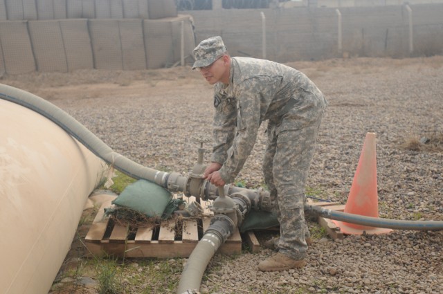 Sgt. Brian Gil, noncommissioned officer in charge of the water site at Contingency Operating Location Poliwoda, Iraq, with the 102nd Quartermaster Company, 80th Ordnance Battalion, 15th Sustainment Brigade, 13th Sustainment Command...